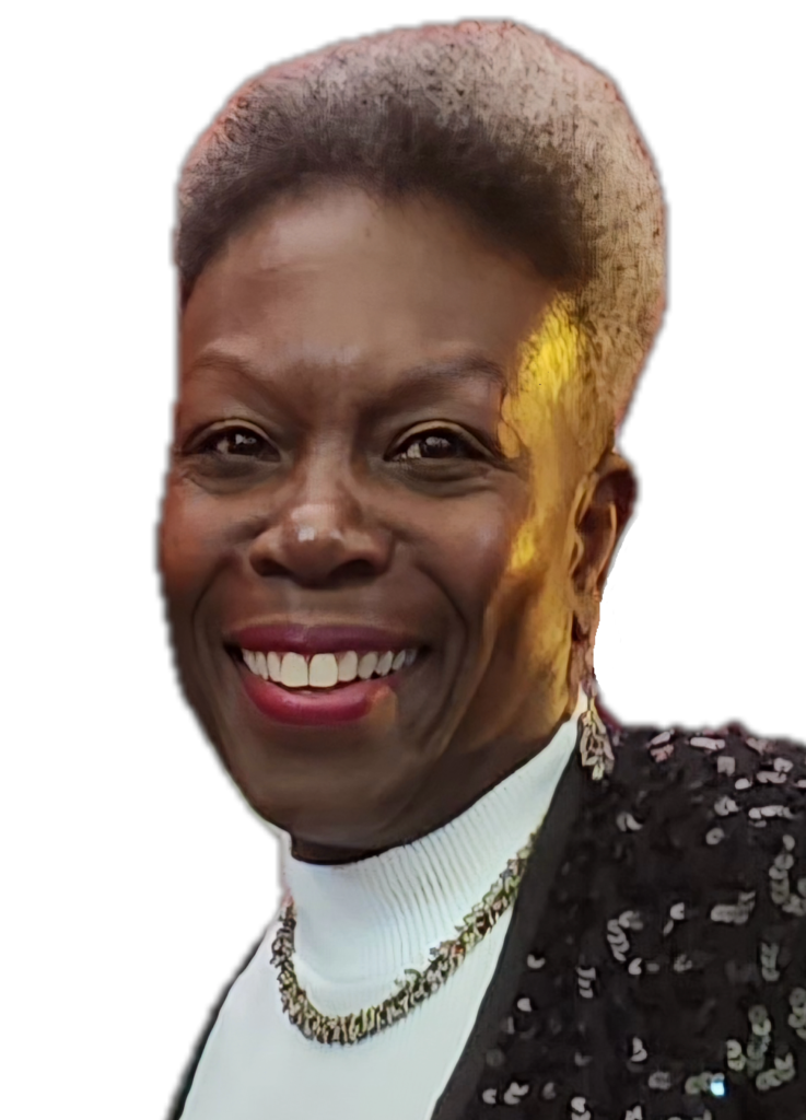 Antoinette GreenOliph, keynote speaker, storyteller, entrepreneur and mentor. Black woman wears a white top and black jacket.